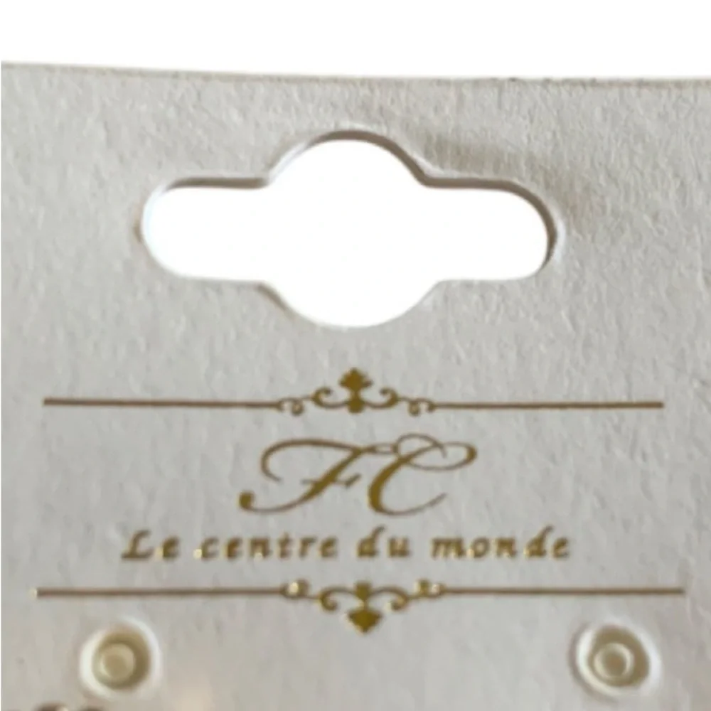 LE CENTRE DU MONDE Earrings Gold Tone White Clover Studs Rhinestone Accent